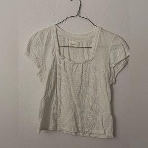 White blouse in cinch material from Anthropologie.